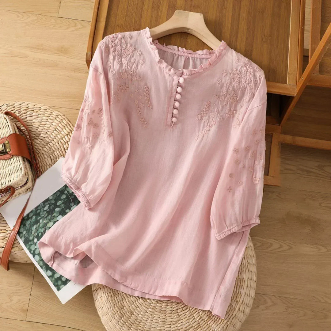 Relaxed fit women's long sleeve boho tunic blouse with intricate embroidery & button front detail.