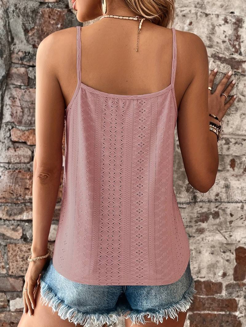 Elegant women's sleeveless V-neck top, embroidered with delicate lace accents, textured finish.