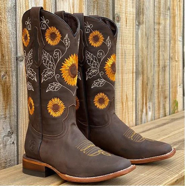 Fashionable women's sunflower embroidered cowboy boots, blending western style with a unique modern flair.