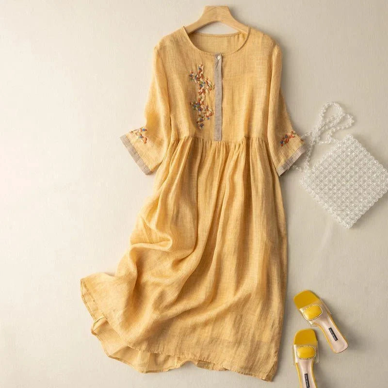 Chic women's day dress: embroidered relaxed midi style, 3/4 sleeves, button front. Ideal for summer fashion.