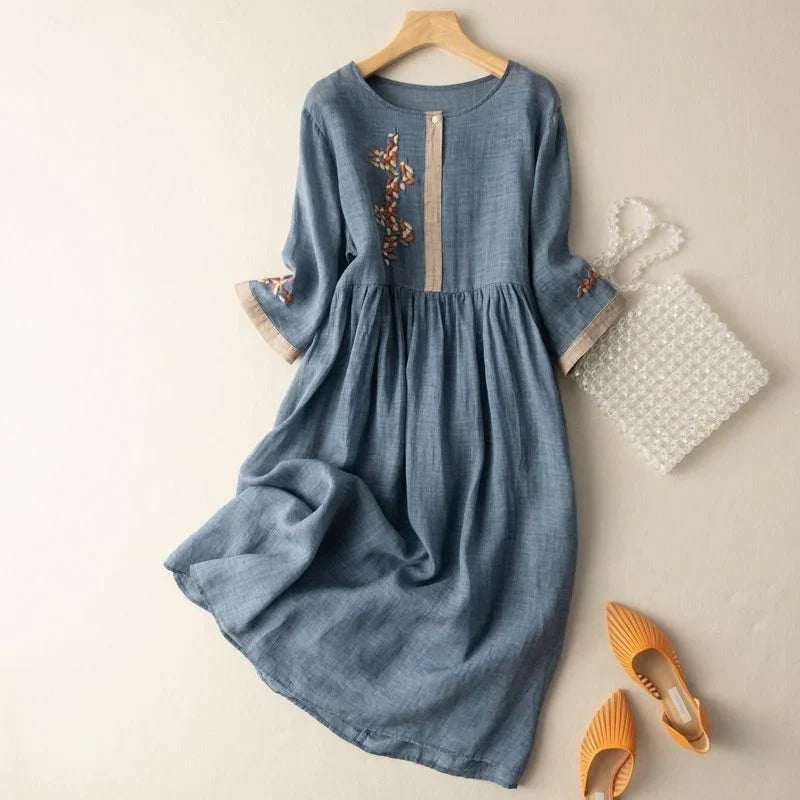 Comfortable relaxed fit midi dress for women featuring delicate embroidery, 3/4 sleeves, and a flowy design.