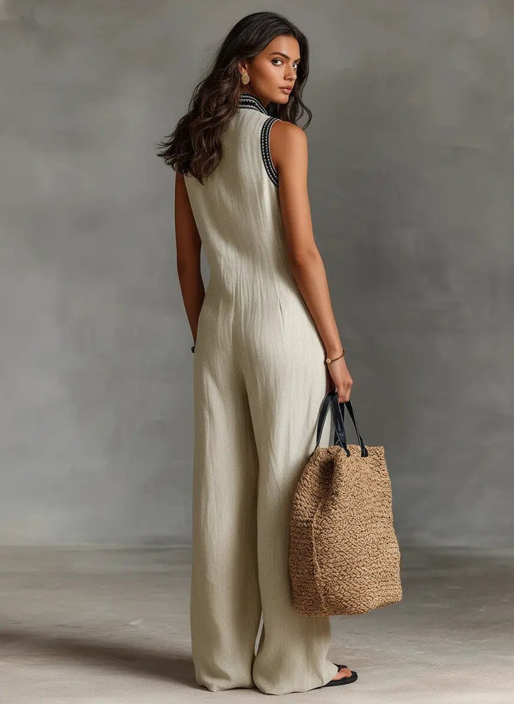 Elegant women's one-piece: sleeveless wide-leg jumpsuit with intricate embroidery details.
