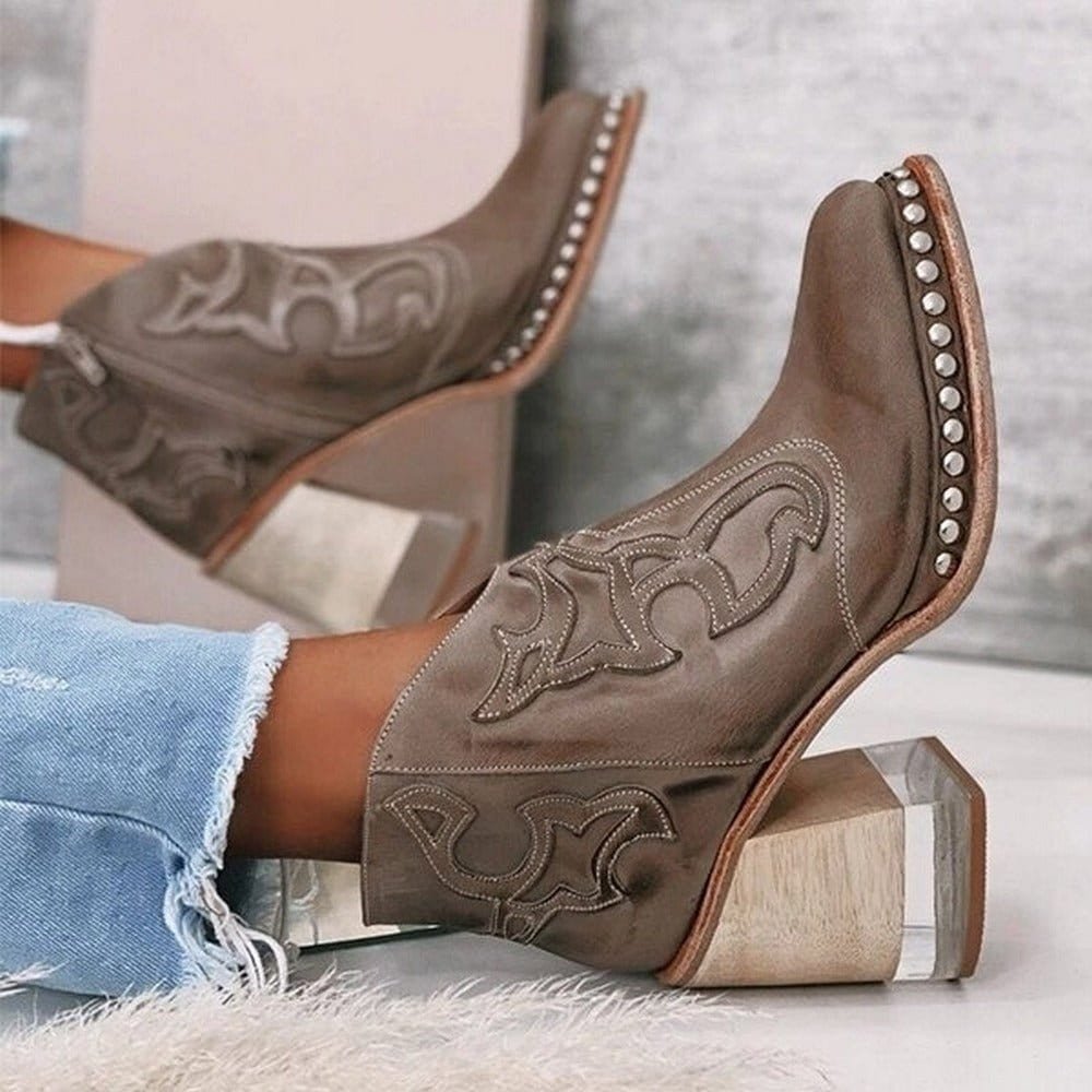 Black women's western ankle boots with intricate embroidery and a sturdy block heel. Chic & fashionable.