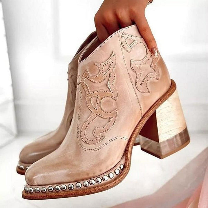 White embroidered western ankle boots for women, a stylish block heel & intricate pattern. Eye-catching.