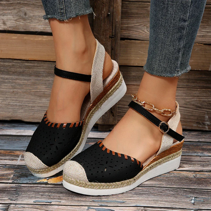 Chic women's espadrille wedge sandals featuring a secure ankle strap and comfortable design.