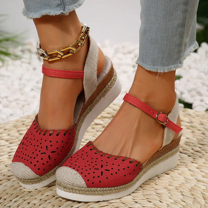 Comfortable women's espadrille wedge sandals with an adjustable ankle strap for a perfect fit.