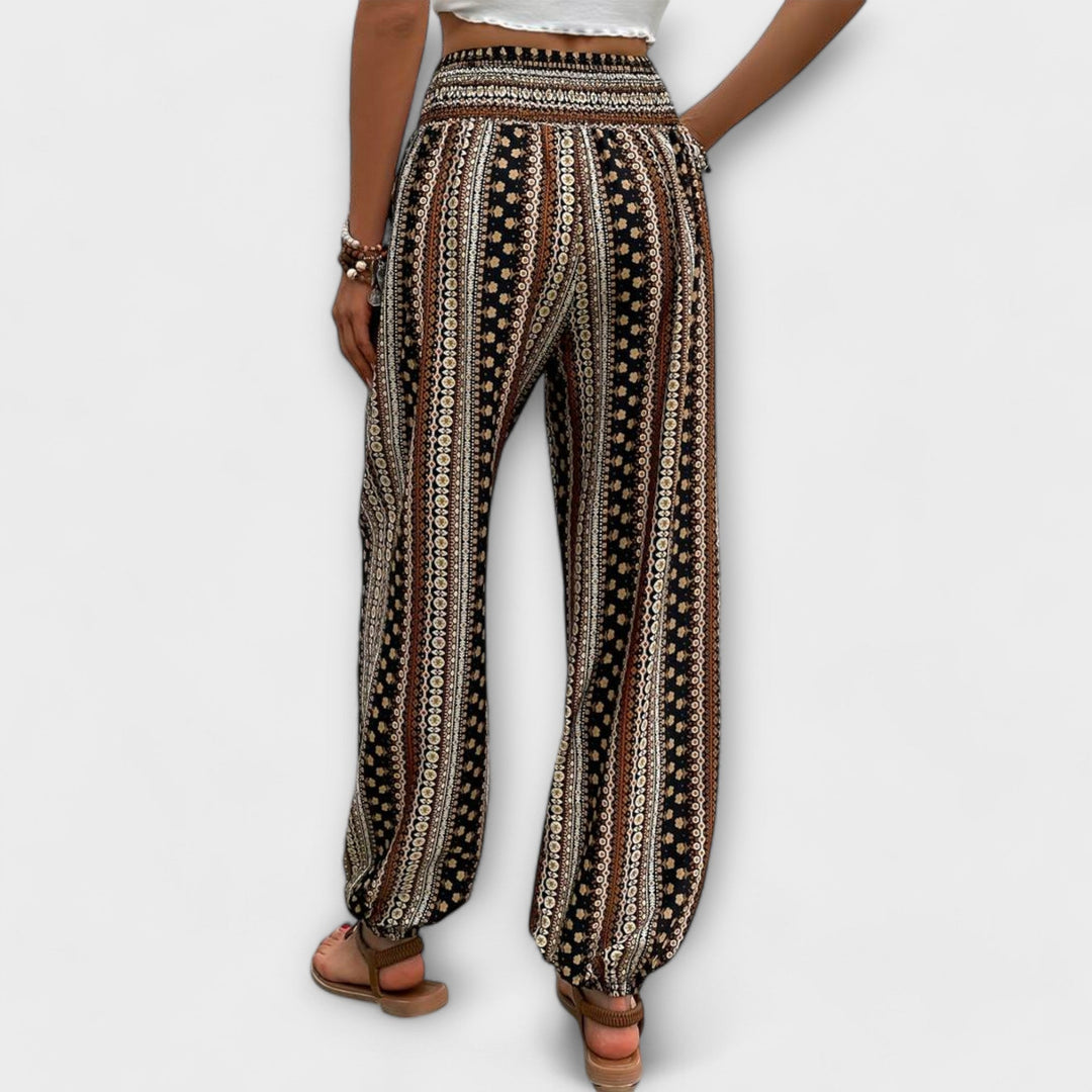 Comfortable women's trousers featuring a vibrant ethnic graphic print, perfect for casual wear.