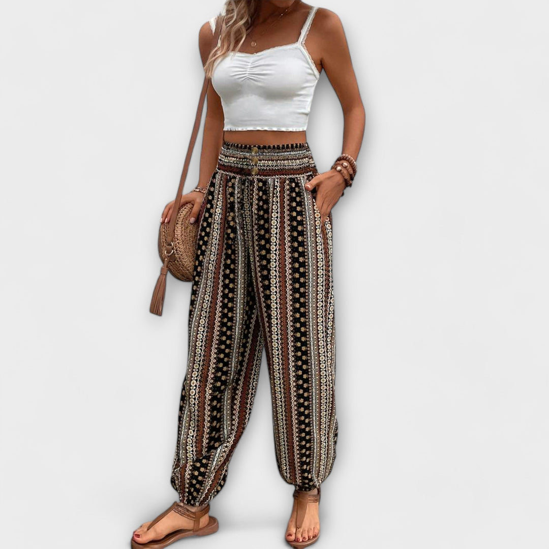 Stylish women's graphic pants with an eye-catching ethnic pattern, ideal for a fashion statement.