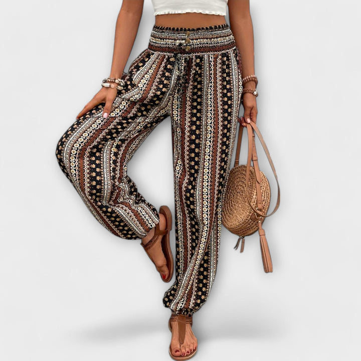 Versatile women's bohemian chic trousers. Soft fabric and a bold ethnic graphic design for comfort.