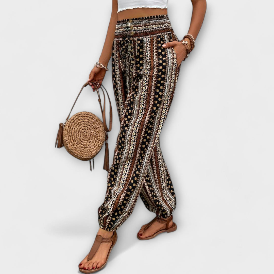 Close-up of the intricate ethnic graphic print on stylish women's comfort trousers.