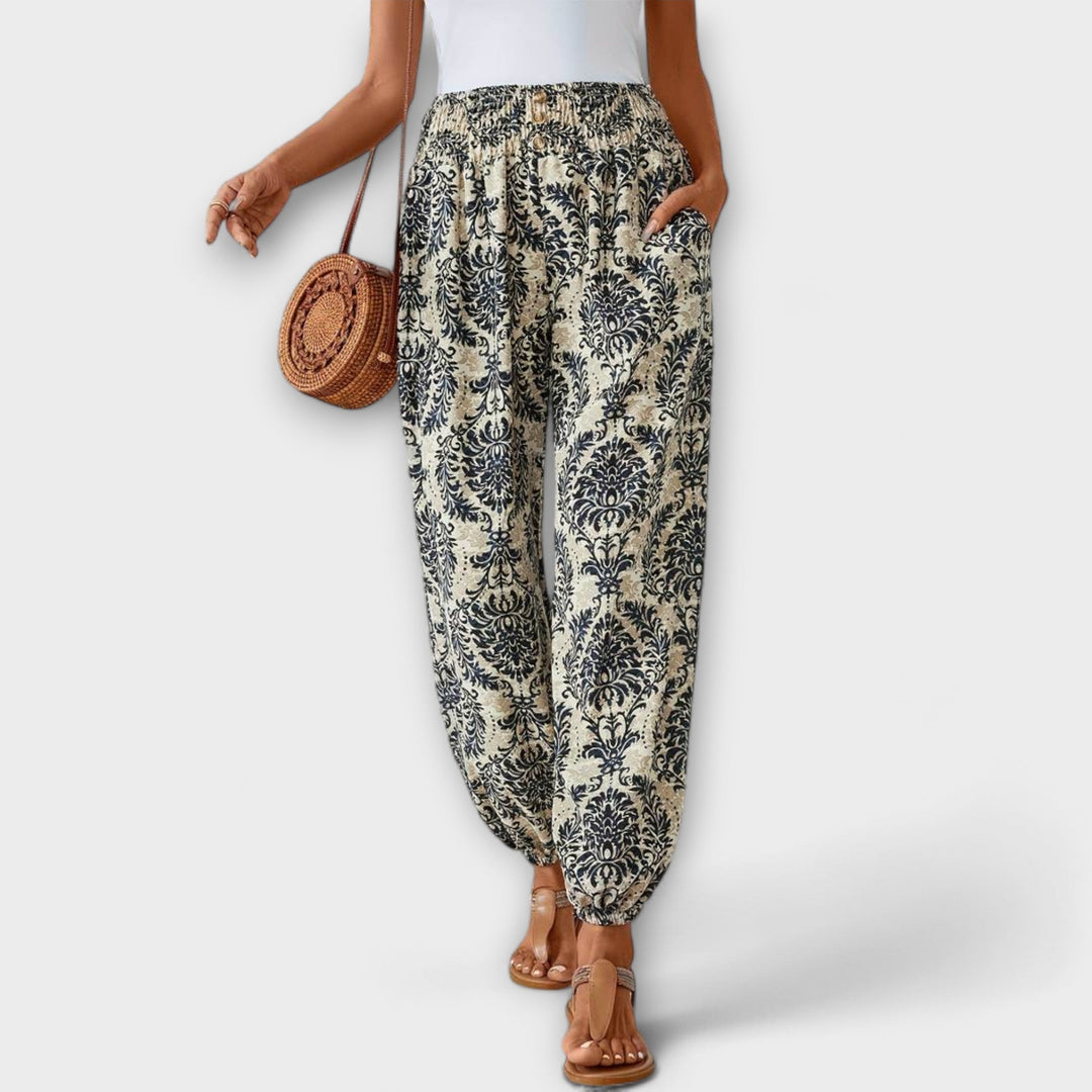 Casual women's ethnic graphic pants. Relaxed fit and vibrant pattern for versatile styling.