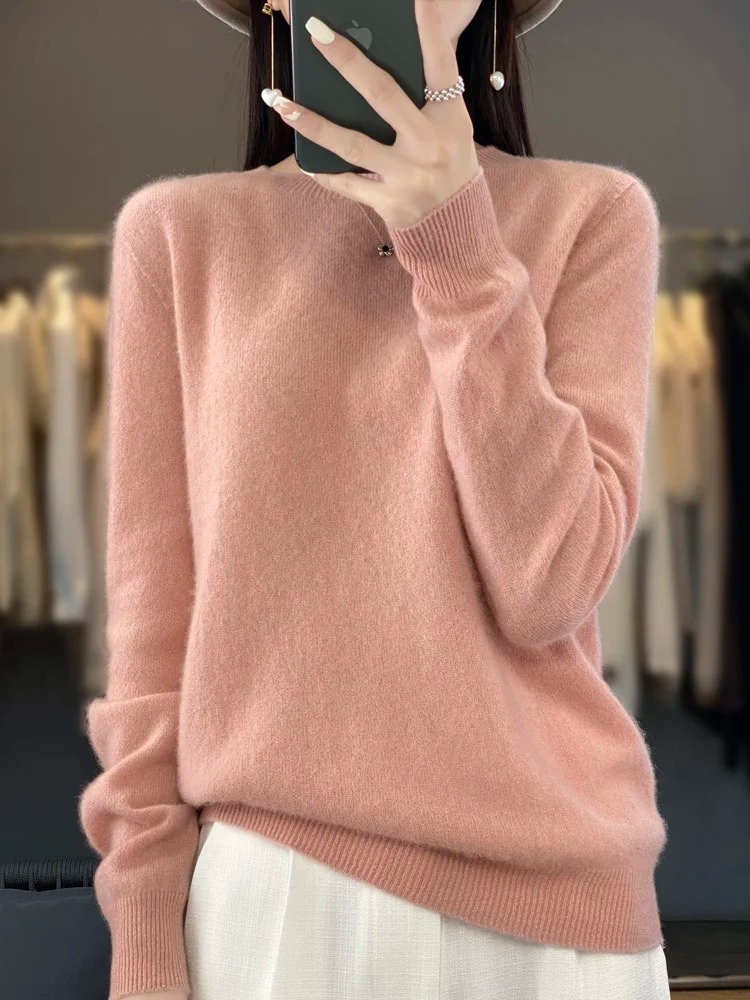 Product shot of women's round neck sweater, a versatile long sleeve top for everyday elegance & comfort.