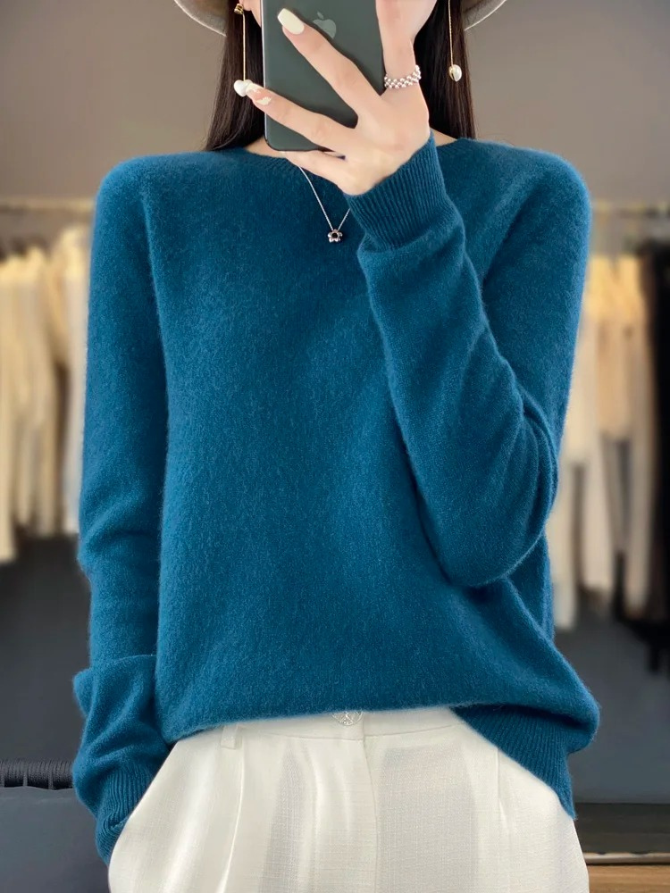 Modern women's round neck long sleeve sweater, offering comfort and elegant everyday fashion. All seasons.