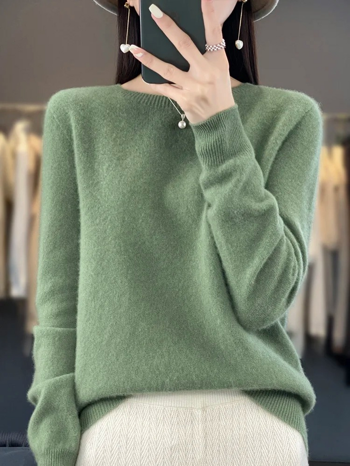 Close-up of soft knit texture on women's round neck sweater, comfortable, elegant, and ready for daily wear.