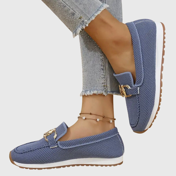 Stylish women's flat slip-on loafers with a comfortable round toe design for everyday wear.