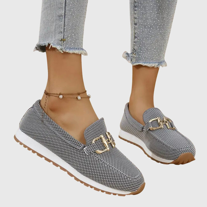 Effortless women's casual loafers with a comfortable flat sole and stylish slip-on design.