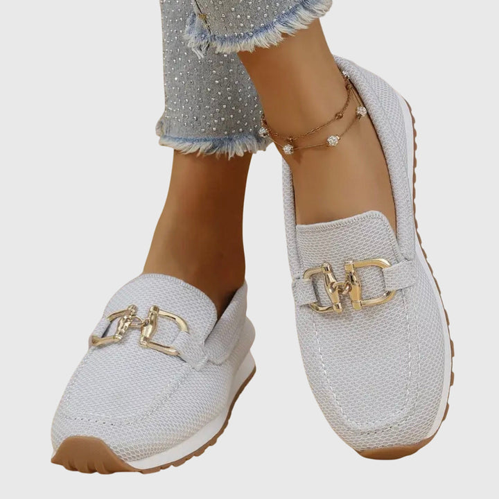 Comfortable women's everyday loafers with subtle buckle detail, perfect for casual fashion.