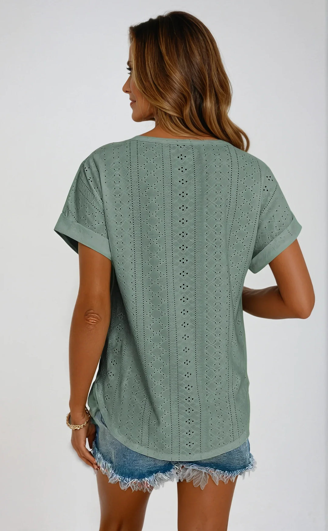Elegant women's eyelet top, short-sleeve, crew neck. Versatile spring & summer fashion.