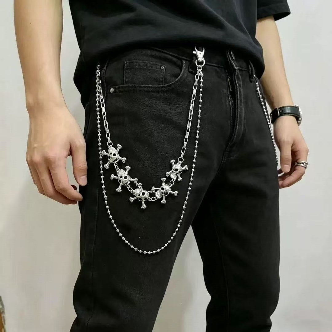 Women's chain belt with decorative cross pendants, a versatile and trendy fashion accessory.