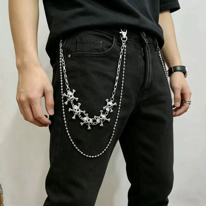 Fashionable women's accessory: a metal chain belt adorned with multiple cross pendants.