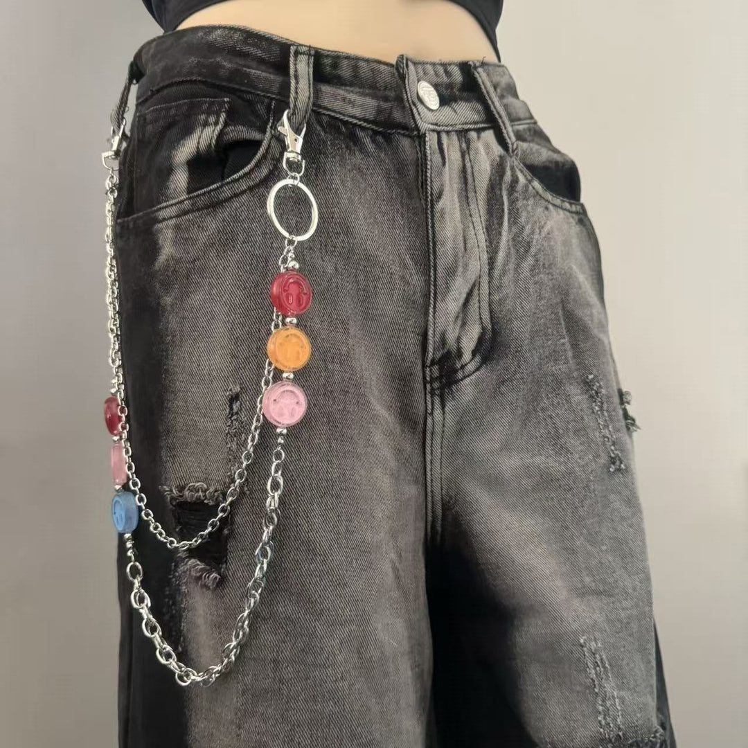 Women's fashionable chain belt with colorful charms, a trendy waist accessory perfect for dresses and tunics.