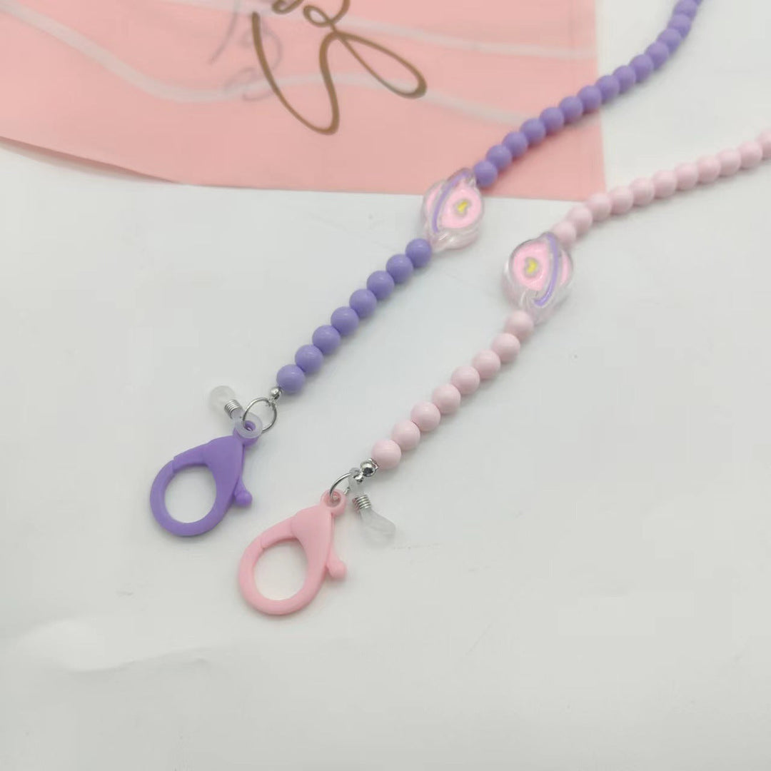 Stylish lilac glasses holder neck strap, a fashionable women's eyewear chain lanyard accessory. Practical & elegant.