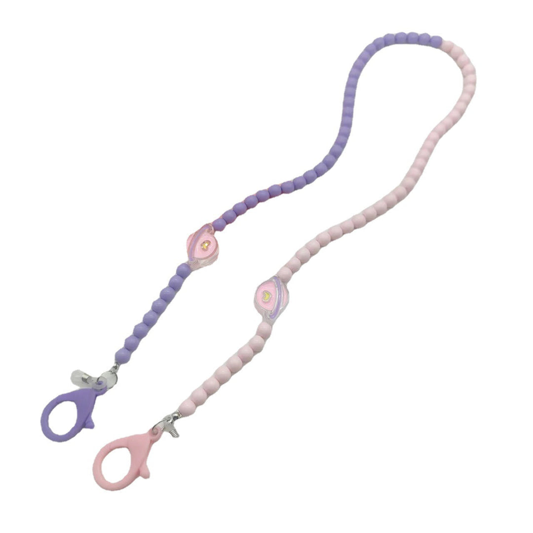Fashionable women's glasses lanyard, a stylish eyewear holder neck chain in a delicate lilac hue. Practical gift idea.