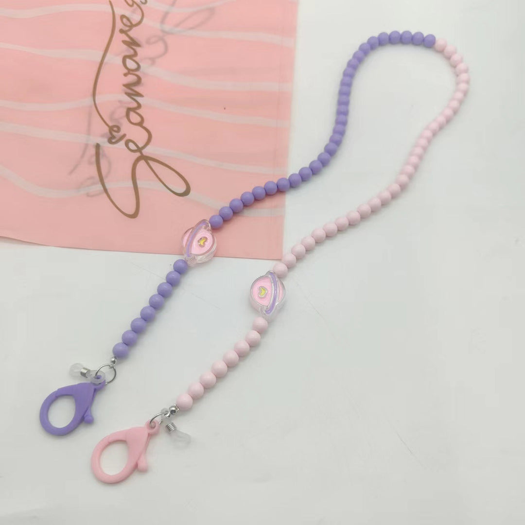 Chic lilac eyewear accessory, a practical women's glasses chain neck strap. Fashionable holder lanyard for daily use.
