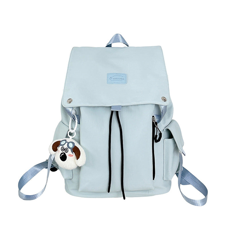 Vibrant multi-pocket women's backpack, versatile for travel, school, or a chic daily casual look.