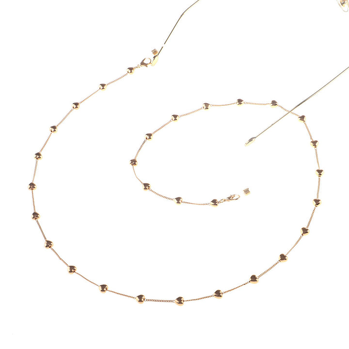 Stylish gold glasses chain for women, featuring elegant heart pendants. A chic eyewear accessory & glasses holder.