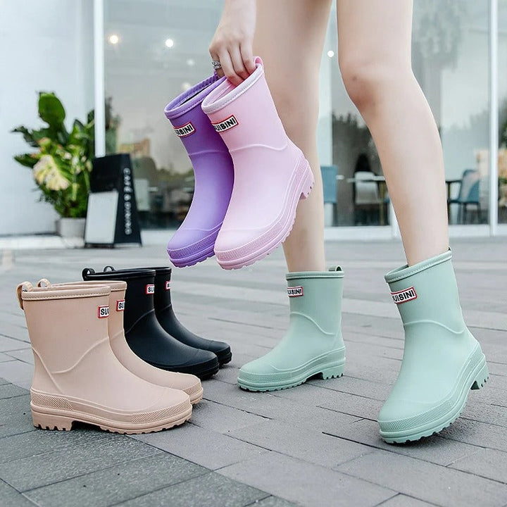 Stylish women's waterproof rain boots, perfect for wet weather & muddy conditions.
