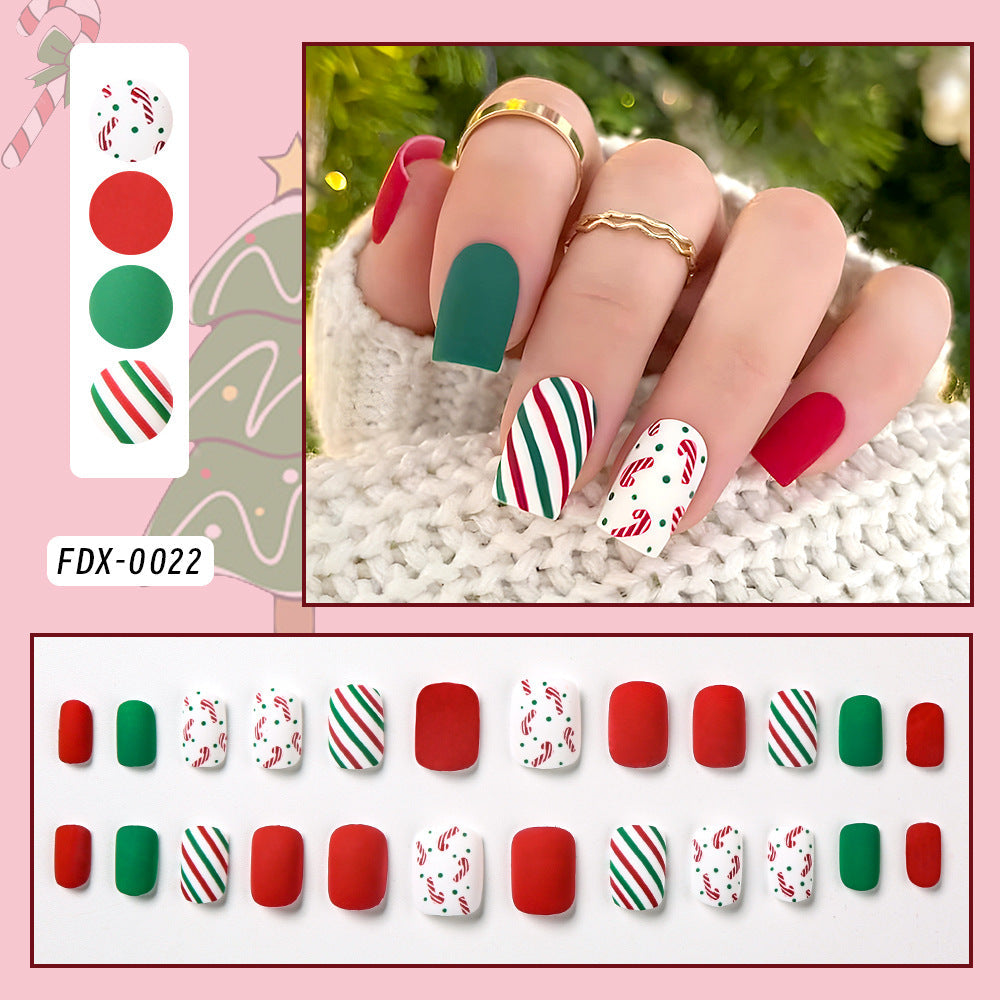 Transform your look with women's festive candy cane press-on nails. Quick & easy Christmas nail art application.