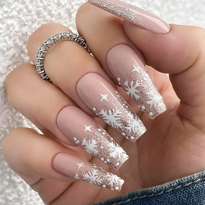 Women's festive glitter snowflake press-on nails. Shimmering false nails for holiday manicures & seasonal beauty.