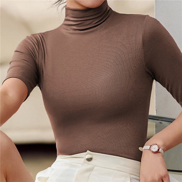 Comfortable women's fitted turtleneck elbow sleeve top. Slim fit blouse, elegant for everyday wear.