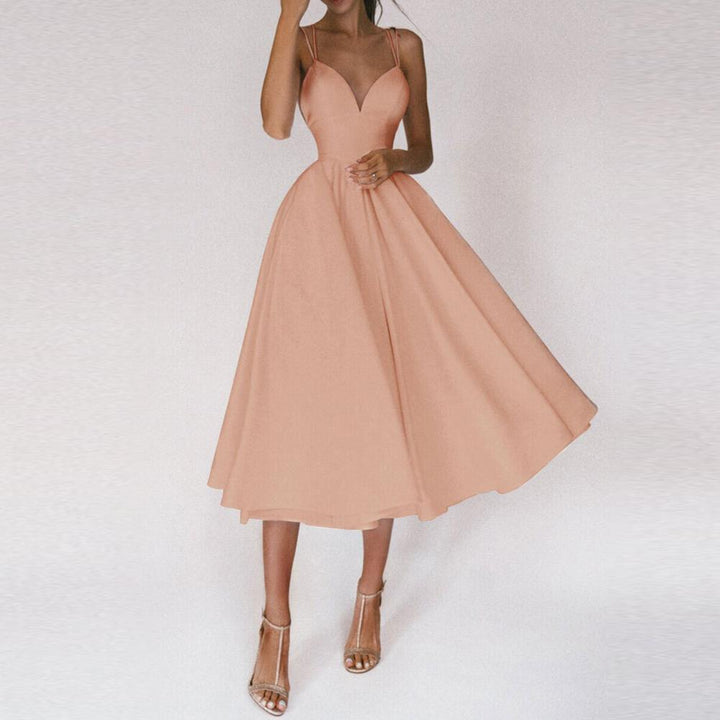 Sophisticated women's sleeveless midi dress with a structured bodice, flared skirt & chic strap design.