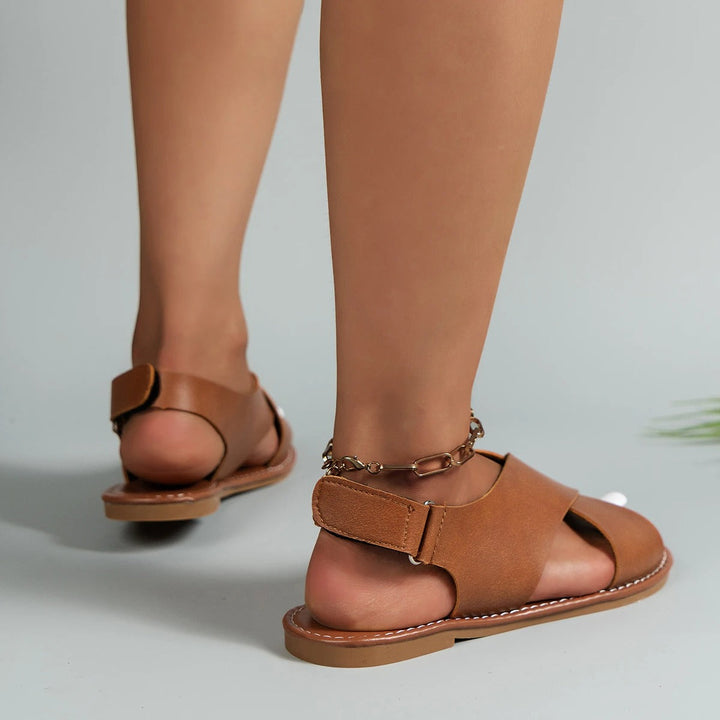 Versatile women's comfortable flat sandals with adjustable buckles, perfect for summer casual and travel.
