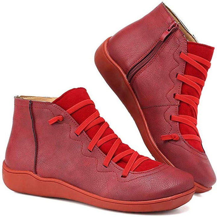 Comfortable women's flat ankle boots featuring a stylish lace-up front and practical side-zip.
