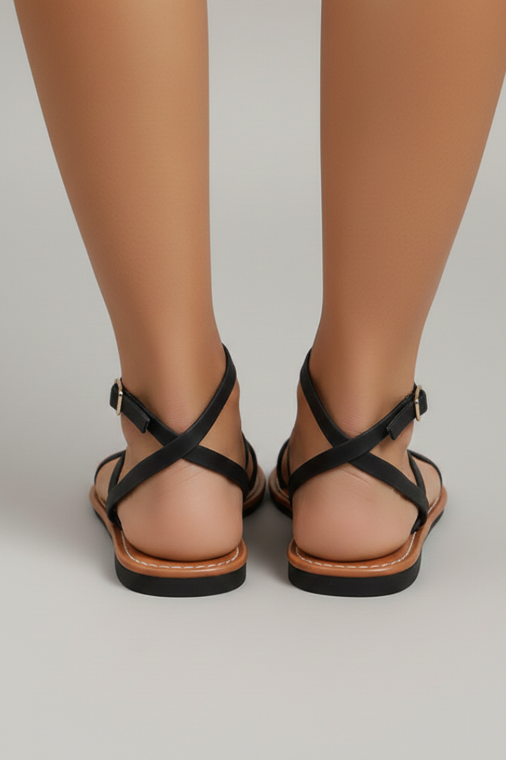 Comfortable women's strappy flat sandals, designed with an open toe & secure ankle strap for summer.