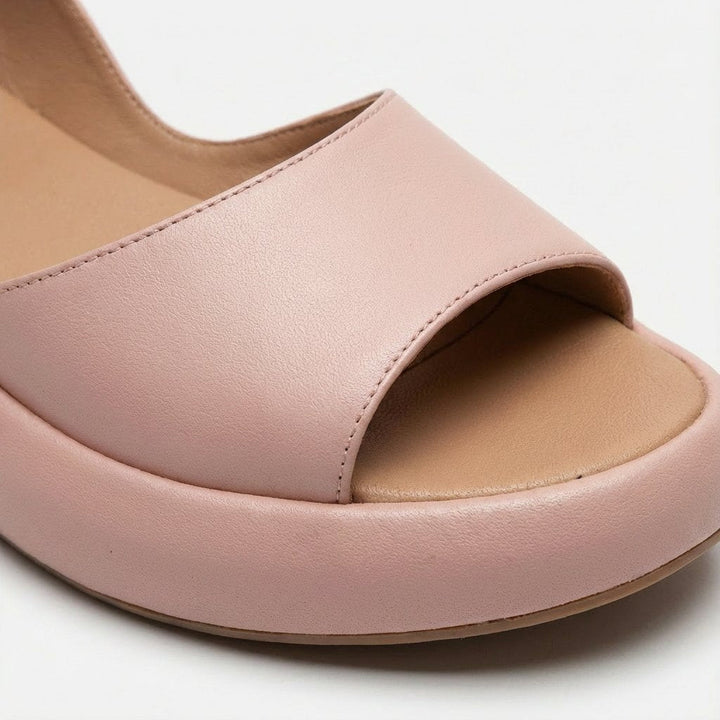 Stylish ladies' slip-on flatform slingback sandals, offering relaxed comfort for warm weather.
