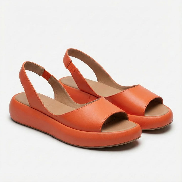 Close-up of a women's flatform slingback sandal showing the comfortable sole and textured straps.
