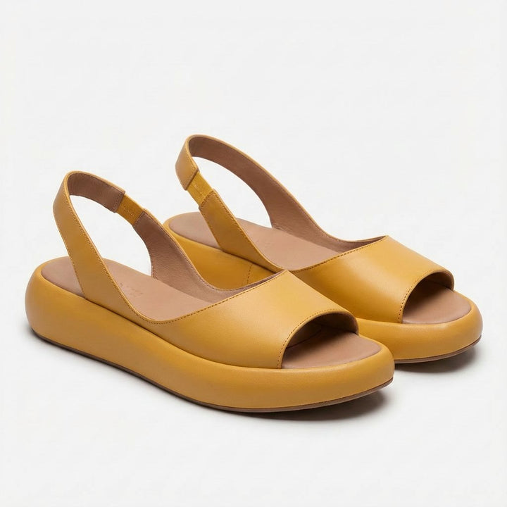 Modern peep-toe flatform slingback sandals for women, combining fashion and all-day comfort.