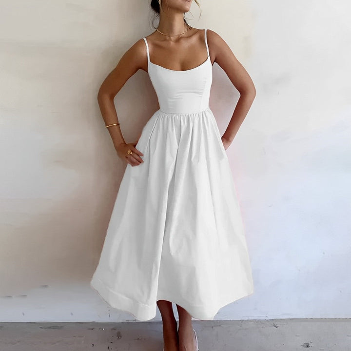 Women's flattering A-line midi dress in a vibrant color, perfect for effortless spring & summer chic style.