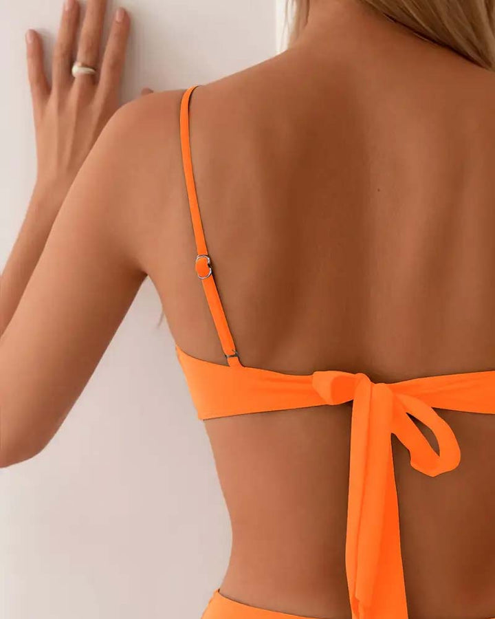 Vibrant orange women's bikini set, a flattering two-piece for your next resort getaway.