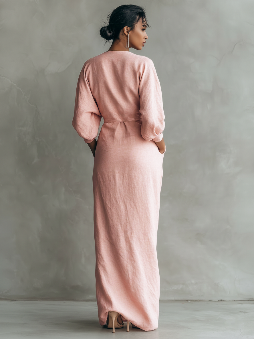 Relaxed fit women's wrap maxi dress featuring a flattering V-neck and stylish three-quarter sleeves. Timeless.