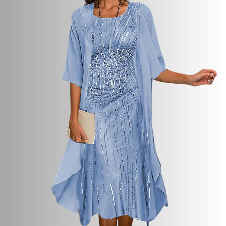 Women's floral layered two-piece set featuring a sleeveless dress & a 3/4 sleeve open cardigan.