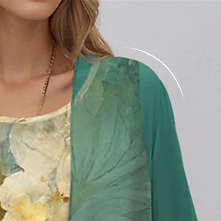 Women's two-piece floral set: sleeveless dress with matching 3/4 sleeve open cardigan. Ideal for casual elegance.