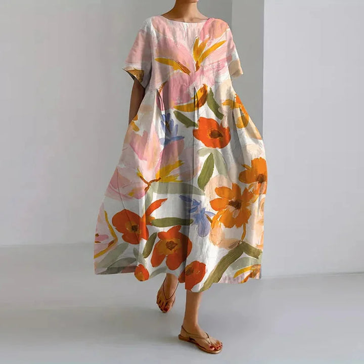 Women's floral A-line midi dress with round neck and short sleeves, perfect for casual summer outings or vacation resort wear.