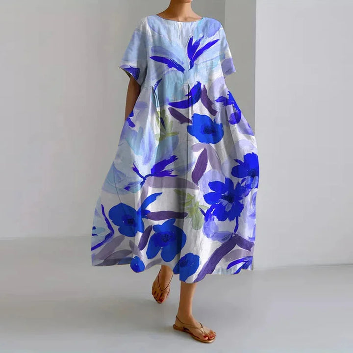 Elegant women's floral A-line midi dress, featuring a round neck and short sleeves, ideal for summer parties or resort wear.