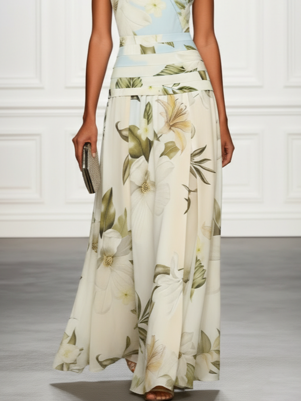 Flowy sleeveless floral maxi dress featuring a chic boat neck design.