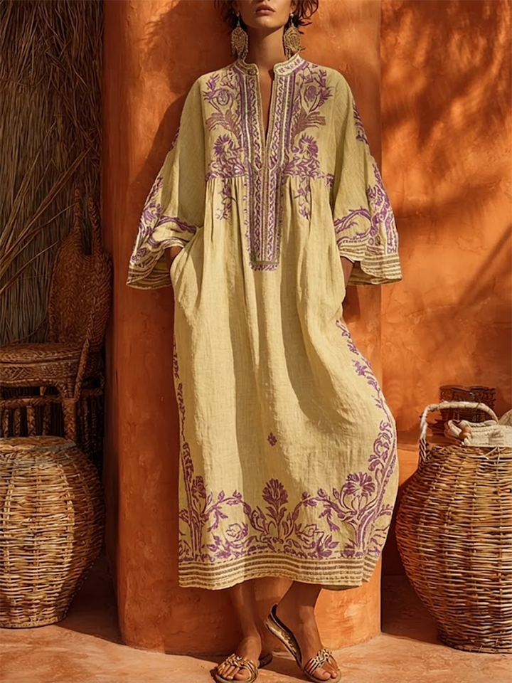 Long sleeve women's boho floral maxi dress, empire waist & mandarin collar, offering a stylish flowing look.